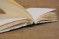 Preview: Cardboard, linen, glue, olive paper, handwork - ingredients for a spelling album